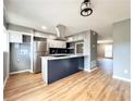 Modern kitchen features stainless steel appliances, granite countertops, and a breakfast bar at 3125 Colonial Way # M, Atlanta, GA 30341