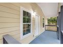 Welcoming front porch featuring freshly painted grey railings and a charming white front door at 2502 Park Dr, Lithonia, GA 30058