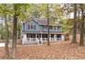 Two-story house with wrap around porch, shutters and landscaping at 101 Emily Ln, Carrollton, GA 30116