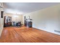 Spacious living room with beautiful hardwood floors, offering plenty of room for dining and gathering at 5655 Campbellton Sw Rd, Atlanta, GA 30331