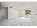 Bright and airy living area with marble floors and a large window at 641 Hamilton E Holmes Nw Dr, Atlanta, GA 30318