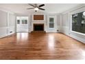Spacious living room featuring hardwood floors and a brick fireplace at 3549 Meadow Chase Dr, Marietta, GA 30062