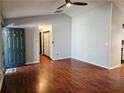Inviting living room features hardwood floors and access to the kitchen at 115 Bond Dr, Ellenwood, GA 30294