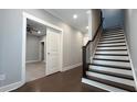 Modern staircase with dark wood treads and white risers at 700 Banton Nw Dr, Atlanta, GA 30318