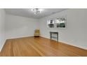 Bright bedroom with hardwood floors, ample natural light, and minimalist decor at 6914 Fairway Trl, Austell, GA 30168