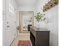 Bright and airy entryway with a large mirror and stylish console table at 956 Cardova Dr, Atlanta, GA 30324