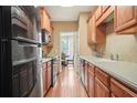Modern kitchen with stainless steel appliances and light wood cabinets at 5030 Bayrose Cir # 30A, Atlanta, GA 30344