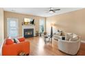 Bright living room features hardwood floors, fireplace, and lots of natural light at 5030 Bayrose Cir # 30A, Atlanta, GA 30344