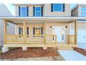 Charming front porch with wooden railings and steps at 6478 Beaver Creek Trl, Atlanta, GA 30349