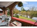 Inviting front porch with brick columns and wicker chairs at 1384 Jefferson Ave, East Point, GA 30344