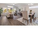 Inviting living and dining area featuring large windows and stylish decor, a perfect gathering space at 1341 Cedarcrest Blvd, Acworth, GA 30101