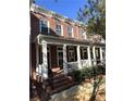 Townhouse exterior featuring a brick facade and porch at 617 Brennan Dr, Decatur, GA 30033