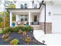 Inviting front porch with rocking chairs and fall decor at 51 Riverbirch Way, Dallas, GA 30157