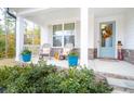 Charming front porch with rocking chairs, pumpkins and fall decor at 51 Riverbirch Way, Dallas, GA 30157