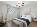 Cozy bedroom featuring a ceiling fan, neutral decor, and natural light from a window at 1284 Piedmont Ne Ave # 5, Atlanta, GA 30309