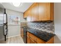 Updated kitchen with stainless steel appliances, granite countertops, and stylish backsplash at 1284 Piedmont Ne Ave # 5, Atlanta, GA 30309