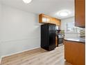 Bright kitchen with modern appliances, stone backsplash, and light wood cabinets at 1284 Piedmont Ne Ave # 5, Atlanta, GA 30309