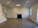 Spacious living room featuring a fireplace and hardwood floors at 372 Bloomfield Cir, Canton, GA 30114