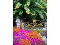 The Dix-Lee On community entrance, landscaped with vibrant flowers at 440 Dix Lee On Dr, Fayetteville, GA 30214