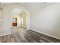 Bright living room with hardwood floors and an arched entryway at 2722 S Hills, Riverdale, GA 30296