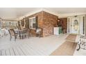 Inviting covered front porch featuring an outdoor seating area at 112 Christopher Ln, Stockbridge, GA 30281