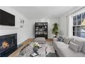 Spacious living room featuring a fireplace and built-in shelving at 10 Chaumont Nw Sq, Atlanta, GA 30327