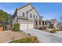 Beautiful two-story home with stone accents, neutral siding, manicured landscaping, and a two-car garage at 3213 Blackley Old, Douglasville, GA 30135