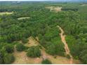 Aerial view of a wooded property showing land ready for new construction at 160 Cross Rd, Covington, GA 30016