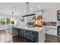 Modern kitchen with large island, quartz countertops, sleek cabinetry, and stainless steel appliances at 2941 Lookout Ne Pl, Atlanta, GA 30305