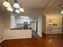 Modern kitchen featuring granite countertops, updated appliances, and white cabinetry at 5914 Sara Ashley Ct, Lithonia, GA 30058