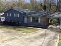 Charming single-Gathering home with a covered parking area and lush greenery at 2787 Heritage Ln, Morrow, GA 30260