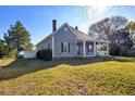 Charming single-Gathering home with a welcoming front porch and well-maintained lawn and landscaping at 4409 Shiloh Rd, Loganville, GA 30052