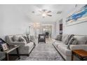Bright and airy living room with stylish furnishings, open layout, and a view to dining area at 6427 Grey Fox Way, Riverdale, GA 30296