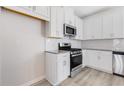 Modern kitchen with stainless steel appliances and white cabinets at 260 Wilder Ridge Way, Lawrenceville, GA 30044