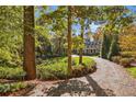 Charming circular driveway leading to a beautiful home surrounded by mature trees at 420 Argonne Nw Dr, Atlanta, GA 30305