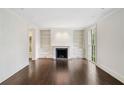 Bright living room with a fireplace flanked by built-in bookshelves at 420 Argonne Nw Dr, Atlanta, GA 30305