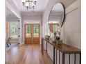 Inviting entryway with hardwood floors, stylish console table, and natural light at 3745 Pilgrim Mill Rd, Cumming, GA 30041
