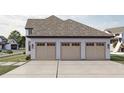 Three-car garage with light-colored wooden doors at 1276 A Rutledge Rd, Acworth, GA 30101