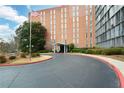 Attractive brick building with a circular driveway, showcasing its well-maintained exterior and inviting atmosphere at 3060 Pharr N Ct # 313, Atlanta, GA 30305