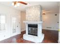 Stone fireplace in living room, hardwood floors at 2068 Lakewood Cir, Grayson, GA 30017