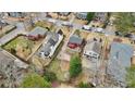 Aerial view of the property nestled in a neighborhood with lush greenery and mature trees at 1114 Adams St, Decatur, GA 30030