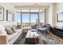 Bright living room featuring city views and sectional sofa at 3630 Peachtree Ne Rd # 2305, Atlanta, GA 30326