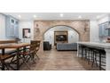Modern living room with brick archway, bar seating, and sleek decor at 61 Alden Nw Ave, Atlanta, GA 30309