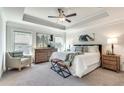 Bright main bedroom with a large bed and plenty of light at 6008 Park Ave, Roswell, GA 30076