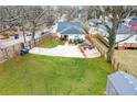 Large, fenced backyard with a patio, green space, and parking area at 1375 Miller Reed Se Ave, Atlanta, GA 30315