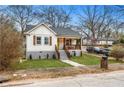 Beautiful home with a well-maintained lawn, shuttered windows, and inviting front porch at 1375 Miller Reed Se Ave, Atlanta, GA 30315