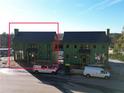 Two-story house under construction next to another at 1200 Lupo Loop, Chattahoochee Hills, GA 30268