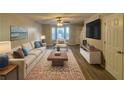 Spacious living room with hardwood floors, neutral walls, and ample natural light at 7069 Ravenwood Ln, Lithonia, GA 30038