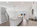 Bright kitchen includes a granite island, stainless appliances, and an open layout ideal for entertaining at 3267 Durston Ct, Dacula, GA 30019