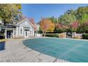 Community pool with a closed cover, pool house and pretty landscaping at 4100 Paces Se Walk # 1306, Atlanta, GA 30339